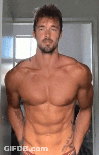 Shirtless Bearded Man Standing In Room GIF