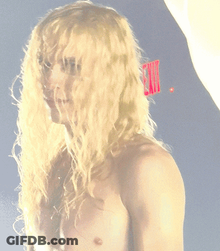 Shirtless Blonde Man With Red Comb In Hair GIF