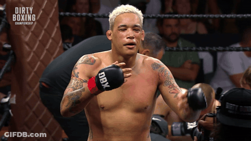Shirtless Boxer With DBX Boxing Gloves In Ring GIF