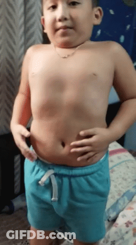 Shirtless Boy In Blue Shorts Holding Belly GIF