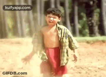 Shirtless Boy In Red Shorts Running In Dirt GIF