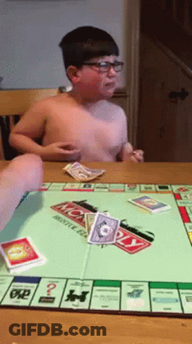 Shirtless Boy Playing Monopoly GIF