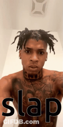 Shirtless Dreadlocked Man With Chest Tattoo And Slap GIF