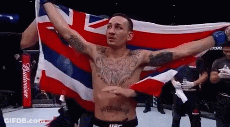 Shirtless Fighter Holding British Flag GIF