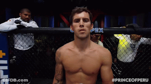 Shirtless Fighter In Cage With Prince Of Peru Hashtag GIF