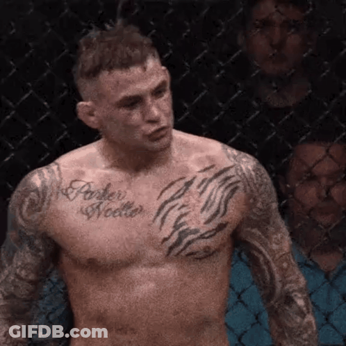 Shirtless Fighter With Chest Tattoo In Cage GIF