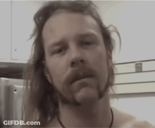 Shirtless Long-Haired Bearded Man Looking At Camera GIF