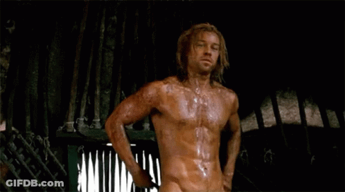 Shirtless Long-Haired Man Standing In Dark Room GIF