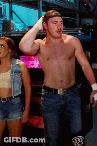 Shirtless Man And Woman In Denim Vest GIF