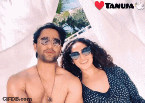 Shirtless Man And Woman Posing With Heart Saying Tanuja GIF