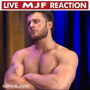 Shirtless Man Arms Crossed Blue Curtain Live MJF Reaction GIF