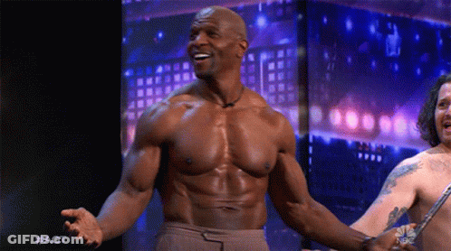 Shirtless Man Arms Outstretched While Another Holds Knife GIF