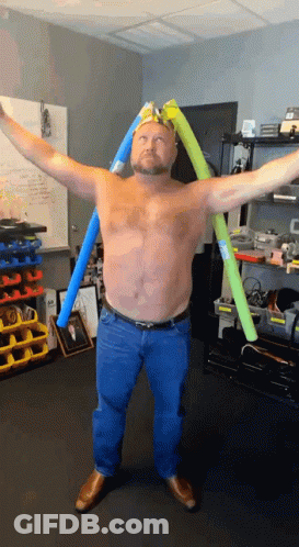Shirtless Man Arms Outstretched With Man Picture Behind GIF