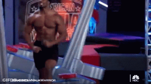 Shirtless Man At American Ninja Warrior Sign GIF