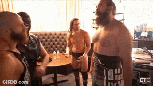 Shirtless Man At Dartboard Says Damn It Feels Good To Be Back GIF