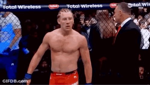 Shirtless Man At Fence With Total Wireless Banner GIF