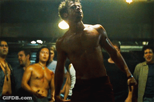 Shirtless Man Before Group Of Men GIF