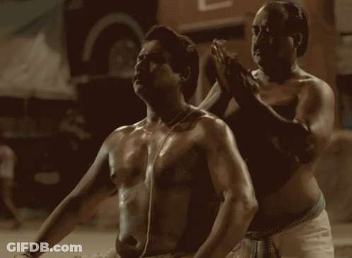 Shirtless Man Being Massaged By Another Man GIF