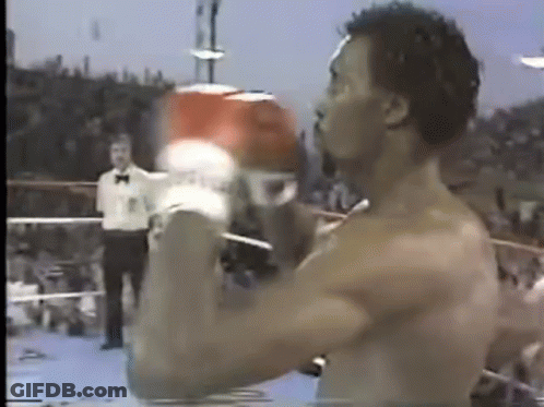 Shirtless Man Boxing Gloves In Ring GIF