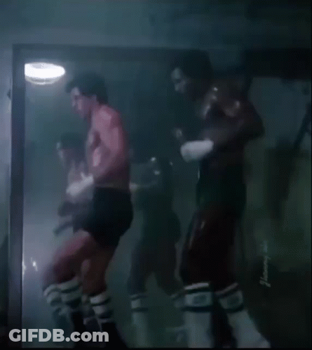 Shirtless Man Boxing In Dark Room GIF