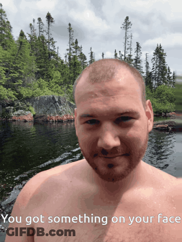 Shirtless Man By Water Saying You Got Something On Your Face GIF
