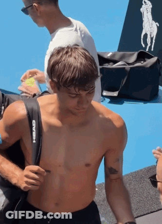 Shirtless Man Carrying Black Head Bag GIF