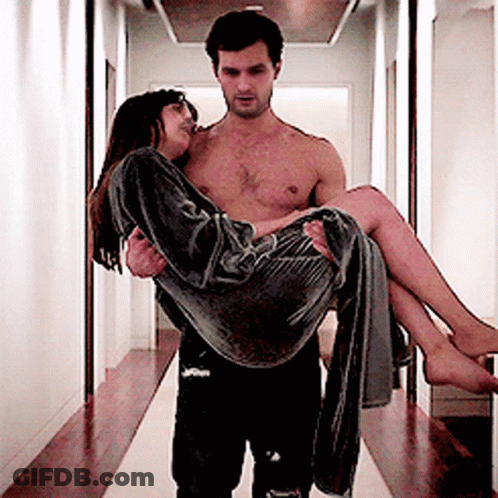 Shirtless Man Carrying Woman In Hallway GIF