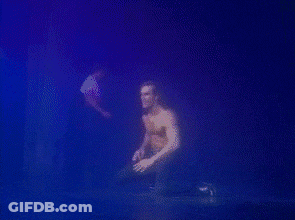 Shirtless Man Crawling With Purple Background GIF