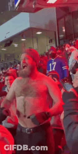 Shirtless Man Dancing At Football Game GIF