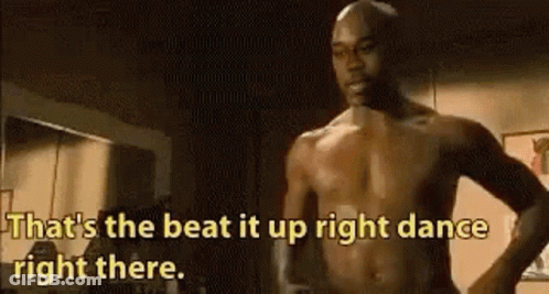 Shirtless Man Dancing In Dark Room GIF