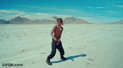 Shirtless Man Dancing In Desert GIF