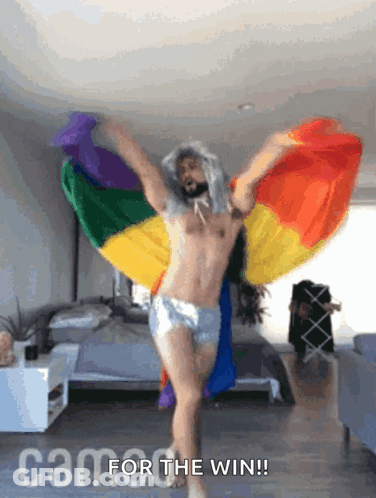 Shirtless Man Dancing In Front Of Rainbow Flag Saying Cam For The Win GIF
