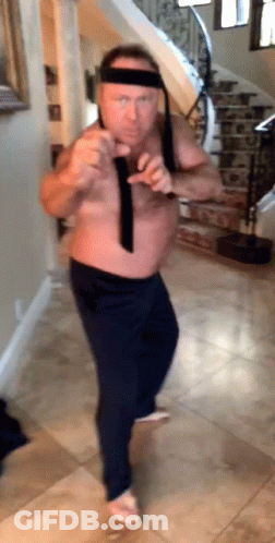 Shirtless Man Dancing In Hallway With Stairs GIF