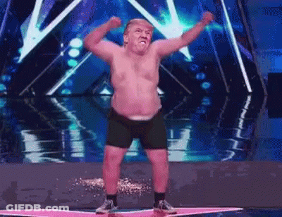Shirtless Man Dancing On Stage Arms Up GIF