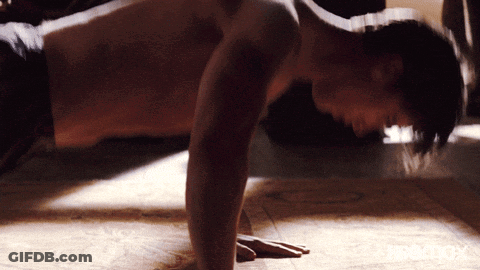 Shirtless Man Doing Push Ups On Wooden Floor GIF