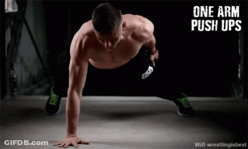 Shirtless Man Doing Push Ups With Text One Arm Push Ups GIF