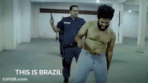 Shirtless Man Escorted By Police Officer This Is Brazil GIF