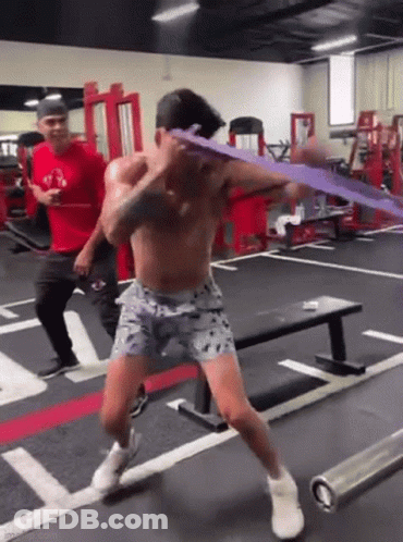 Shirtless Man Exercising With Resistance Band GIF