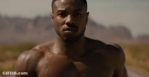 Shirtless Man Faces Camera Desert GIF