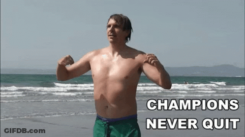 Shirtless Man Flexing Champions Never Quit GIF