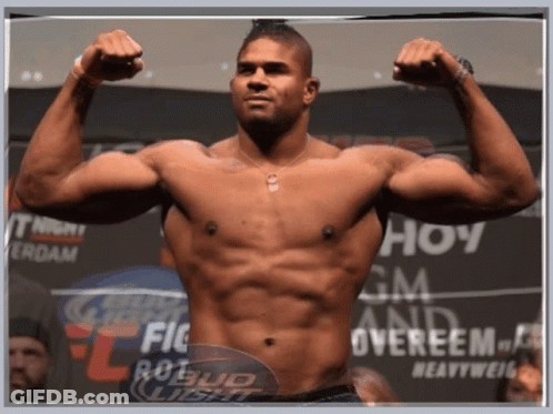 Shirtless Man Flexing Muscles GIF