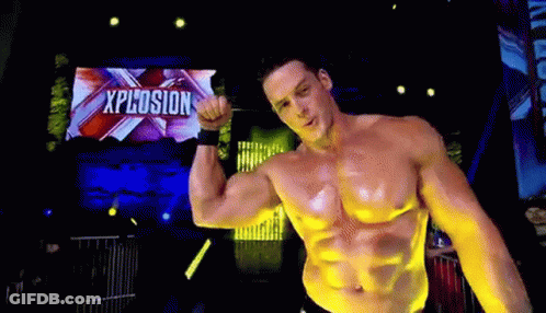 Shirtless Man Flexing Muscles On Stage GIF