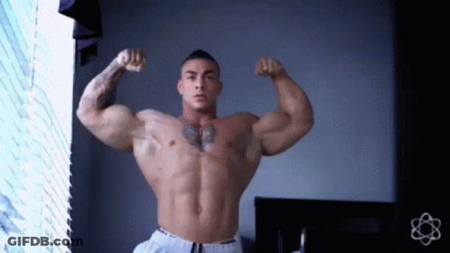 Shirtless Man Flexing Muscles With Chest Tattoo GIF