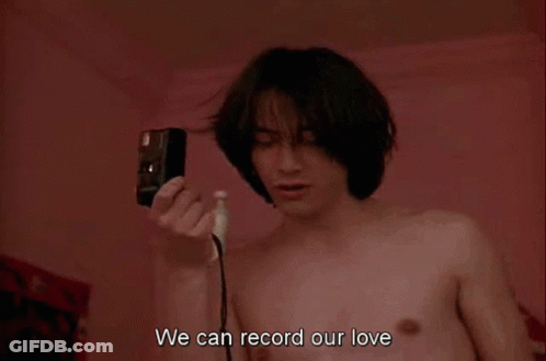 Shirtless Man Holding Camera Says We Can Record Our Love GIF