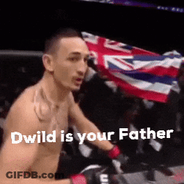 Shirtless Man Holding Flag In Boxing Ring GIF