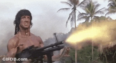 Shirtless Man Holding Gun In Jungle GIF