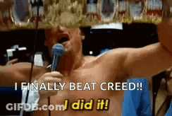 Shirtless Man Holding Microphone Says I Finally Beat Creed GIF