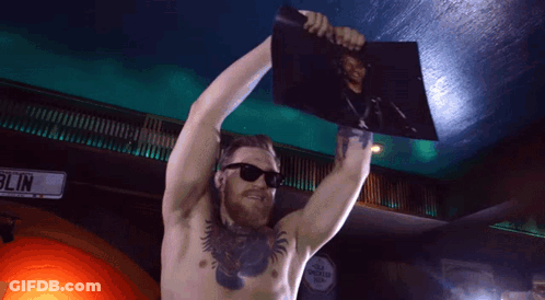 Shirtless Man Holding Picture In Front Of Blin Sign GIF