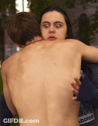 Shirtless Man Hugged By Woman In Adored Shirt GIF