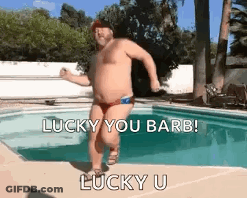 Shirtless Man In Bathing Suit Dancing By Pool GIF